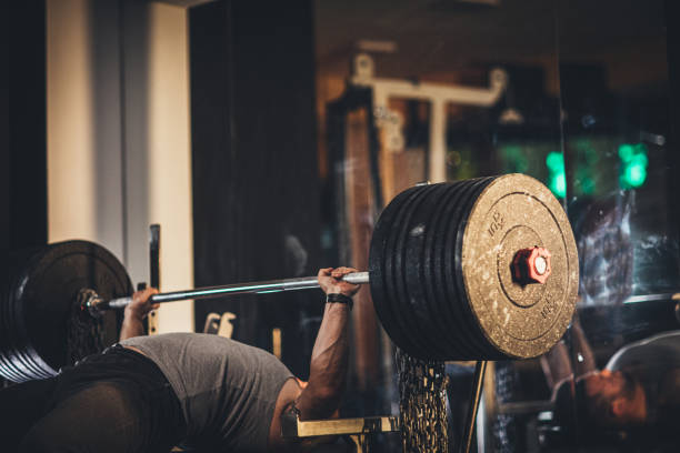 istock Man weightlifter at the gym 1179338849