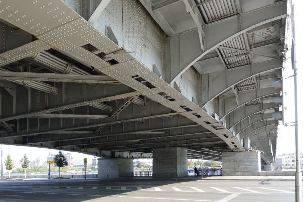istock Construction of an automobile bridge over a river in Moscow. Bottom view 1179338952