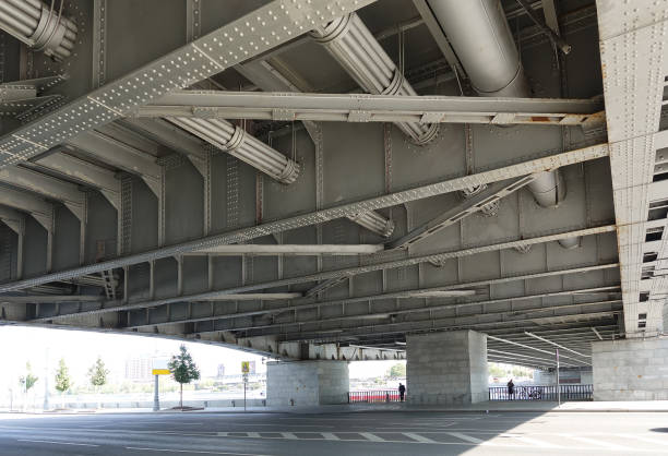 istock Construction of an automobile bridge over a river in Moscow. Bottom view 1179338962