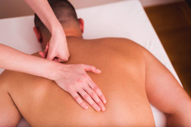 istock Man enjoying sports massage at spa 1179339203