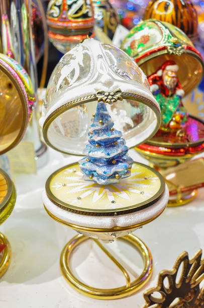 Beautiful white crystal Jeweled Egg with blue christmas tree inside.