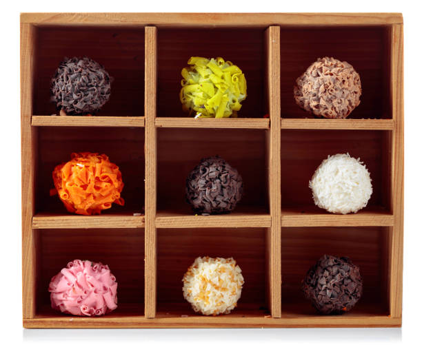 istock Various chocolate candy in wooden box. 1179345895