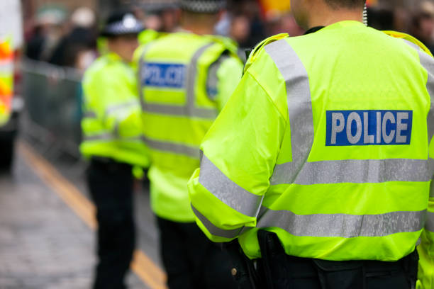 British police crowd control Police in hi-visibility jackets policing crowd control uk stock pictures, royalty-free photos & images