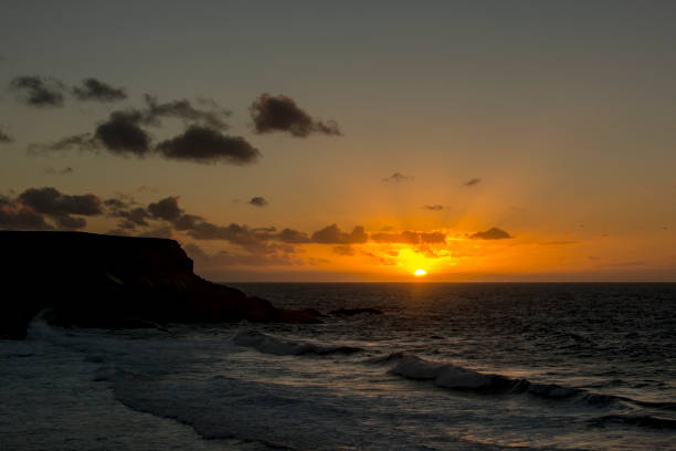 istock orange sunset over the ocean 1179347226
