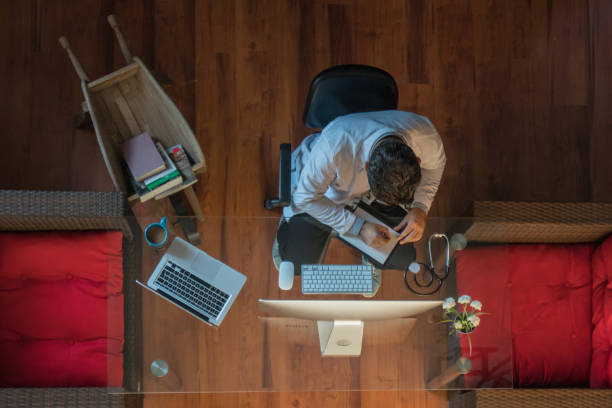 istock Doctor working at desk in office 1179350157