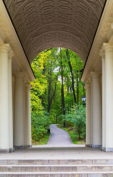 istock Autumn. Ancient arch with columns in a city autumn park. 1179351446