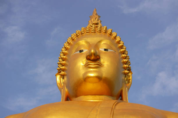 A striking image that showcases the grandeur of large statues at temples in Koh Samui, including the prominent figures of Buddhist and Chinese deities. These monumental sculptures stand not only as religious icons but also as masterpieces of cultural artistry, against the backdrop of Thailand's lush tropical landscape.