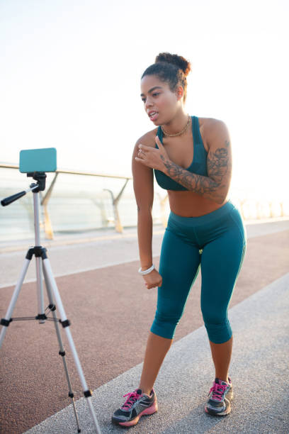 istock Sports blogger speaking about building muscles while making video 1179352613