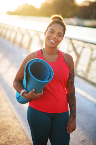 istock Dark-eyed plump woman feeling excited before training 1179352660