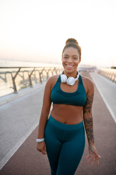 istock Dark-skinned young woman smiling after morning run 1179352899