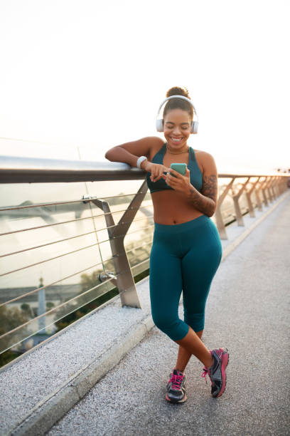 istock Cheerful woman checking on social media after run 1179353270