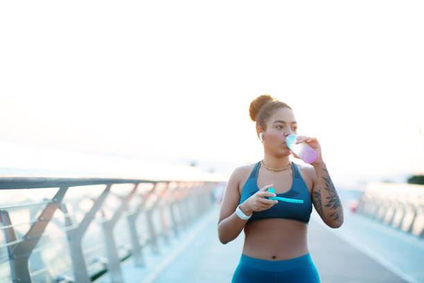 istock Woman feeling thirsty after running for an hour 1179353446