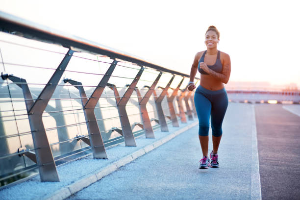 istock Motivated and excited woman feeling amazing while running 1179353474