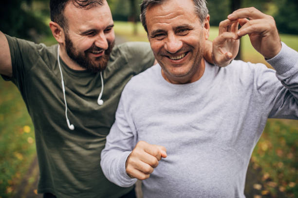 istock Father and son jogging in park 1179353684