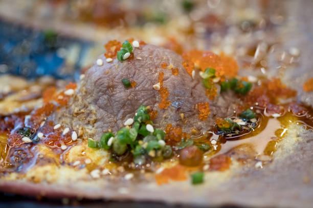 Set of grilled Wagyu beef sushi with Flying fish roe or Tobiko on plate