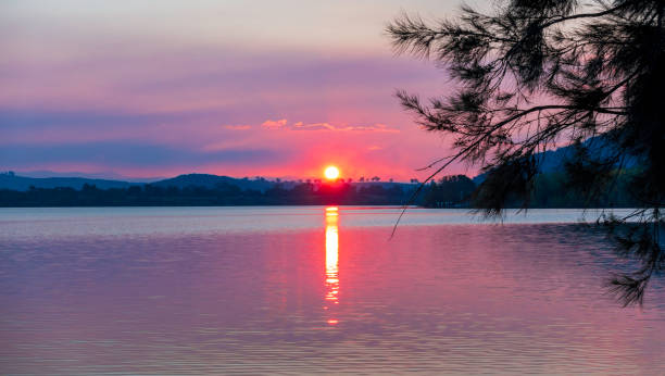istock A calm lake displaying late afternoon colors 1179357577