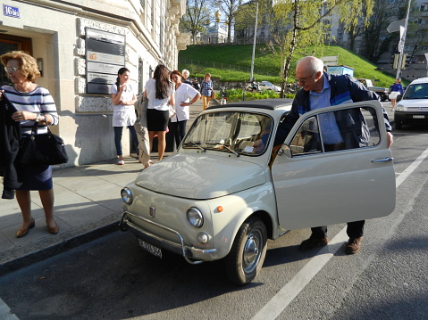 Geneva, Switzerland - April 17, 2013: White Fiat 600 in the Streets of Geneva in Switzerland. The Fiat 600 is a Rear-engine, Water-cooled City Car, Manufactured and Marketed by Fiat from 1955 to 1969.