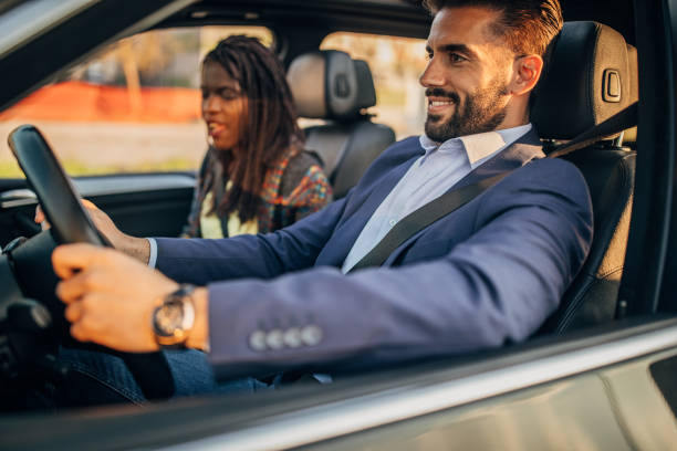 istock Friends traveling by a car 1179360425
