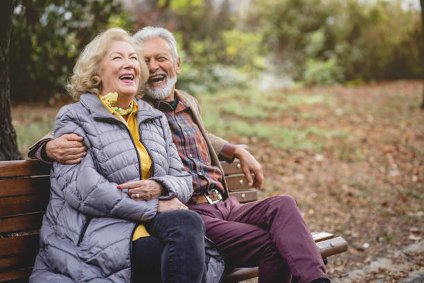 istock Senior Couple enjoying autumn in a park 1179360563