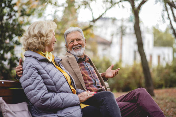 istock Senior Couple enjoying autumn in a park 1179360667