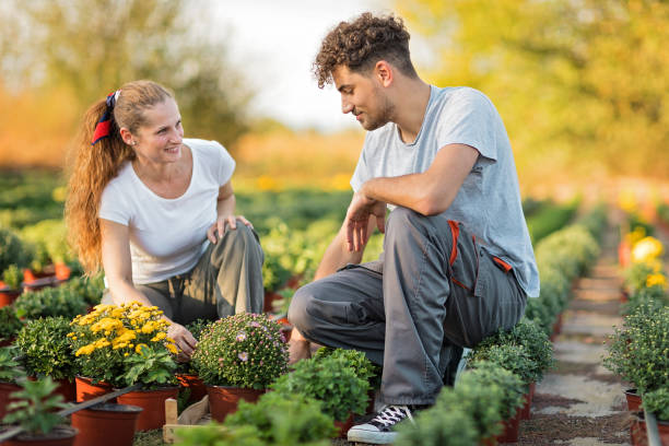istock Two florists gardening flowers 1179361504