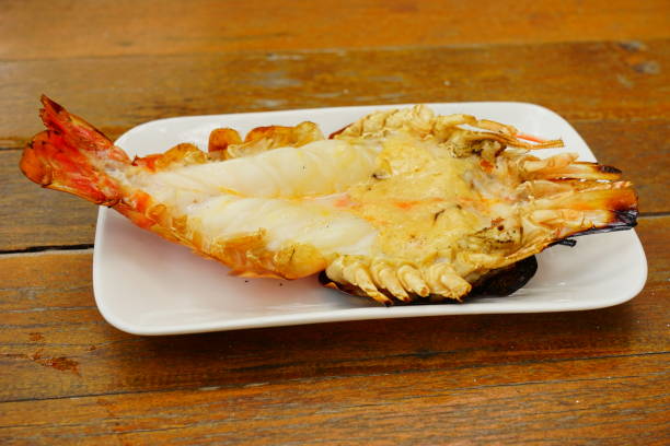 istock Grilled river shrimp River on wood texture background 1179364451