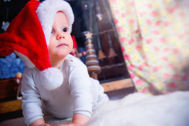 istock Baby Boy Wearing Santa Hat 1179364552