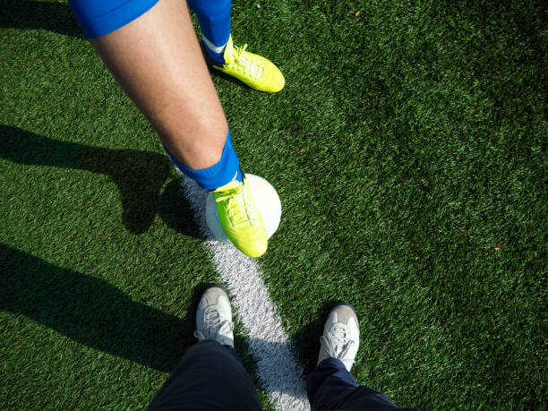 istock Football player and team manager 1179364786