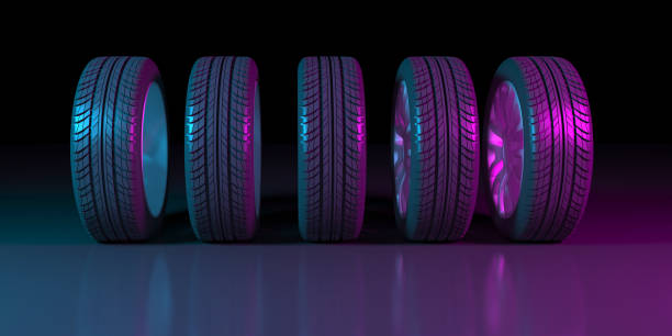 istock black wheels on a black background in neon lighting 1179366024