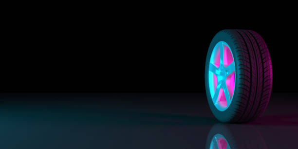 istock black wheels on a black background in neon lighting 1179366045