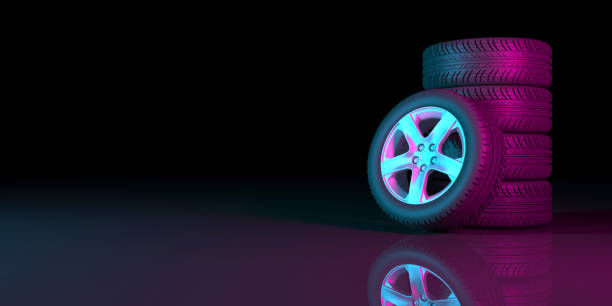istock black wheels on a black background in neon lighting 1179366084