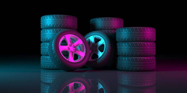 istock black wheels on a black background in neon lighting 1179366114