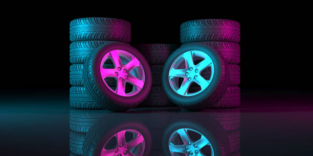istock black wheels on a black background in neon lighting 1179366131