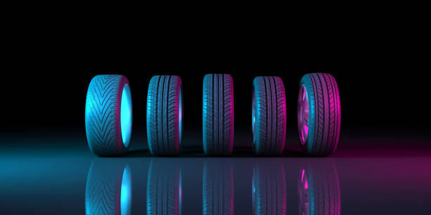 istock black wheels on a black background in neon lighting 1179366171