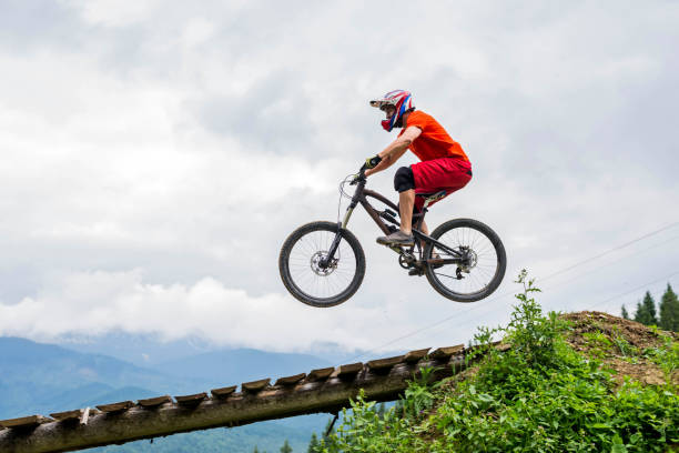 istock Mountain bike jump, copy free space for your text. 1179366379