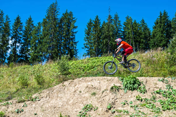 istock Mountain bike jump, copy free space for your text. 1179366380