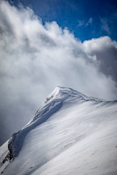 istock swiss alps mountain peak cloudscape, switzerland 1179366691
