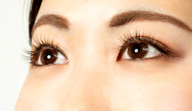 istock Eyelash extension treatment 100 eyelashes 1179366781