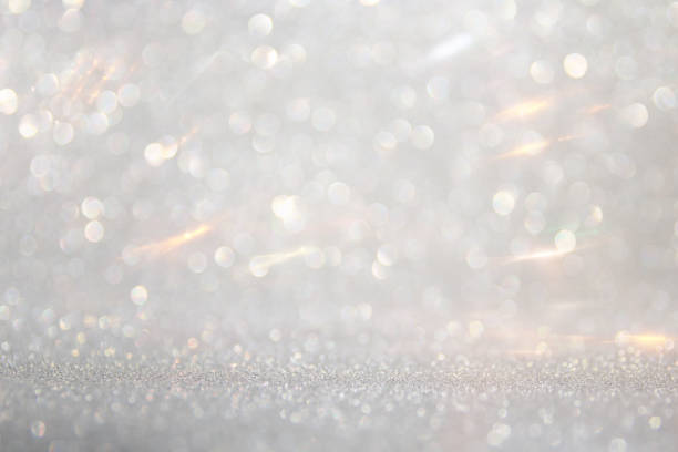 istock abstract backgrounf of glitter vintage lights . silver and white. de-focused 1179368038