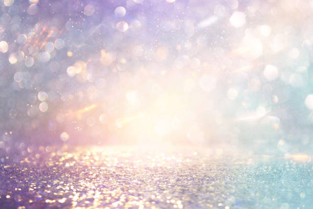istock abstract glitter pink, purple and gold lights background. de-focused 1179368163