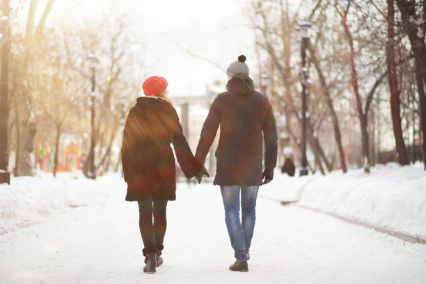 istock Young couple walking through the winter 1179368380