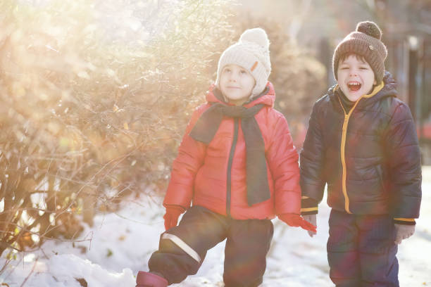 istock Children in winter park play 1179369192