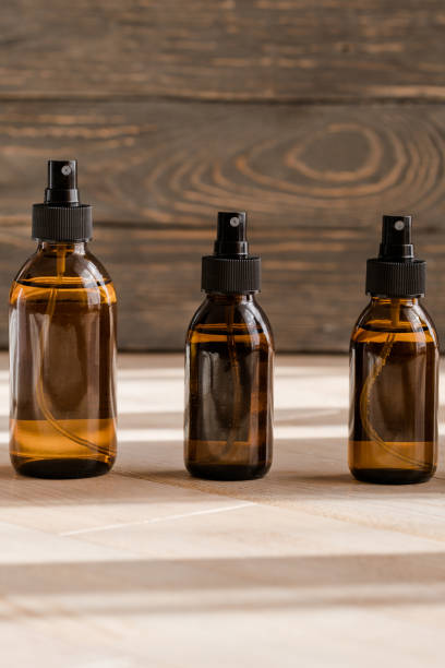 istock Cosmetic dark amber bottles on wooden  table 1179369362