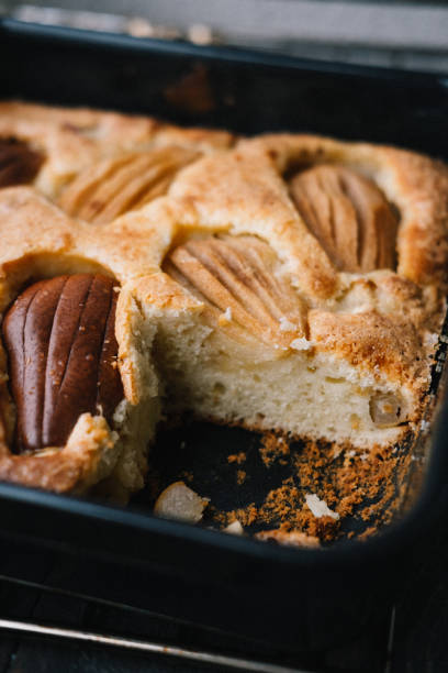 Fall french pear cake in a black ceramic bakeware