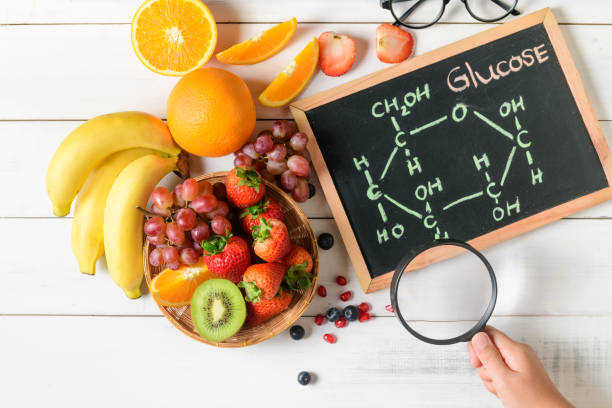 istock Glucose molecule on blackboard with mixed fresh fruits salad 1179371029