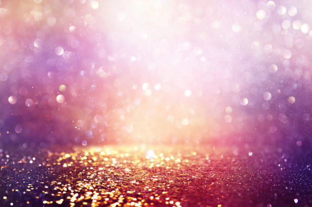 istock abstract glitter pink, purple and gold lights background. de-focused 1179372263