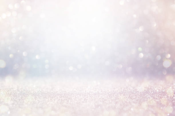 istock abstract backgrounf of glitter vintage lights . silver and white. de-focused 1179372264