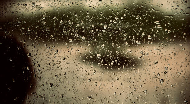 istock Rain water drops on a glass surface unique photo 1179374892