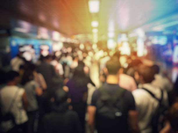 istock blurred image of Crowded station with people and passenger standing, walking and waiting for pick and choose the best public transport during rush hour in Bangkok city. 1179376121