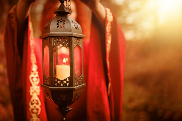 istock Woman holding a lantern with a candle. 1179377780
